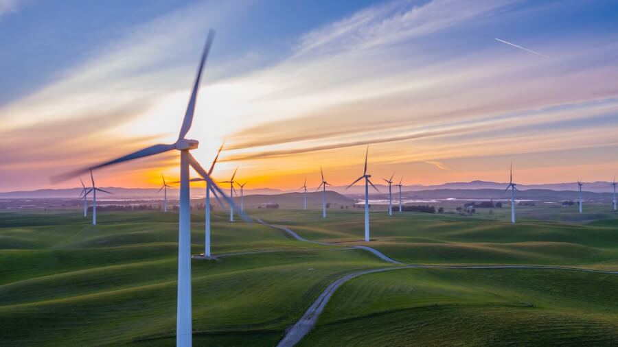 white wind mill lot on green field