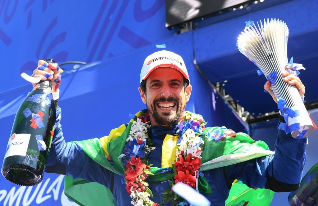 HOMESTEAD, FLORIDA - APRIL 12: Second placed Lucas di Grassi of Brazil and Lola Yamaha ABT Formula E Team celebrates on the podium during the Miami E-Prix, Round 5 of the 2025 FIA Formula E World Championship at Homestead-Miami Speedway on April 12, 2025 in Homestead, Florida. (Photo by Simon Galloway/LAT Images for Formula E)